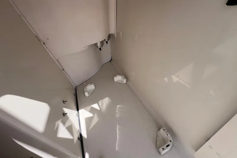 Slide: The Image of 2005 Hydra-Sports Vector 3300 VX interior, showcasing clean, white compartment space. - 92