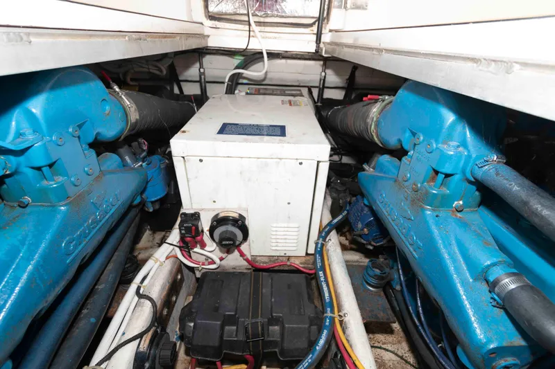 Slide: The Image of Engine room of 2003 Carver 350 Mariner with Crusader engines and electrical components. - 21