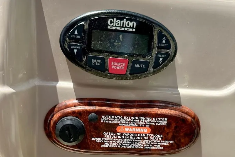Slide: The Image of Clarion Marine audio system and warning label on 2004 Sea Ray 200 Sundeck boat. - 11