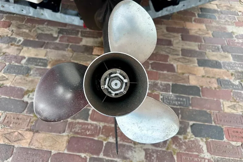 Slide: The Image of Propeller of a 2004 Sea Ray 200 Sundeck on a brick surface. - 7