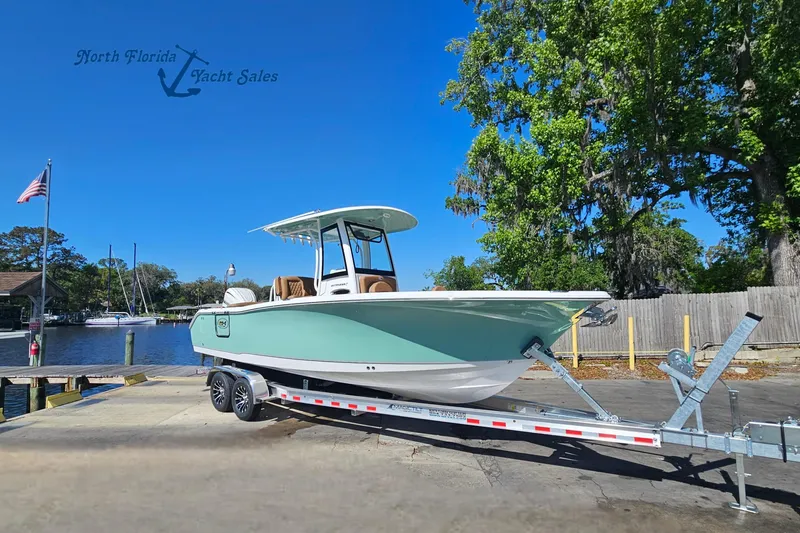 The Image of 2026 Sea Hunt Ultra 255 SE boat on trailer at North Florida Yacht Sales dock. - 0