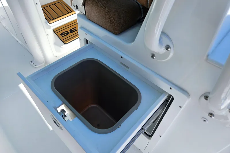 Slide: The Image of 2026 Sea Hunt Ultra 255 SE boat interior storage compartment. - 15
