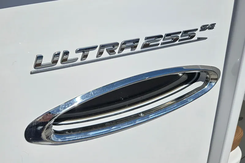 Slide: The Image of 2026 Sea Hunt Ultra 255 SE boat emblem with chrome detailing. - 31