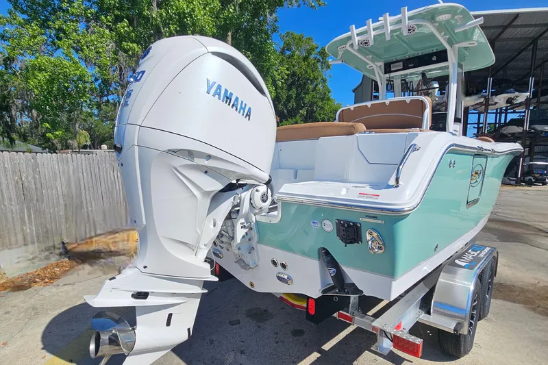 Slide: The Image of 2026 Sea Hunt Ultra 255 SE boat with Yamaha engine on trailer. - 4