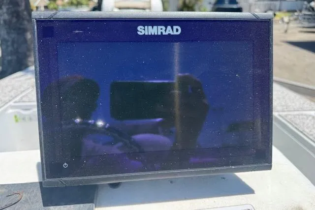 Slide: The Image of Simrad marine display on 2004 Ranger 191 Cayman boat dashboard. - 11