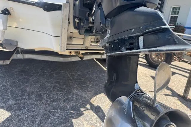 Slide: The Image of Outboard motor of a 2004 Ranger 191 Cayman boat on a trailer. - 4