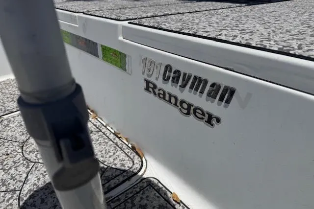 Slide: The Image of 2004 Ranger 191 Cayman boat with textured surface and visible branding. - 6