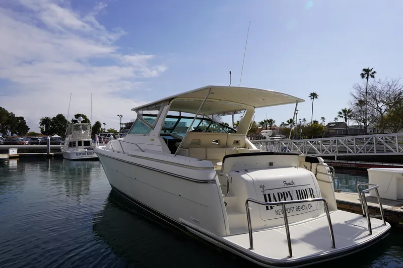 Slide: The Image of 1994 Tiara Yachts 4000 Express docked at marina, Newport Beach, clear sky. - 11