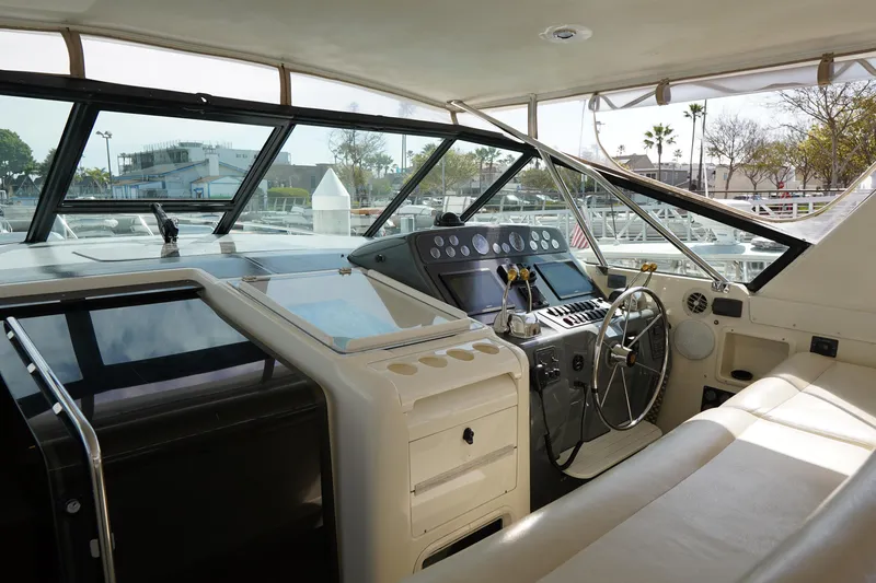 Slide: The Image of Interior view of 1994 Tiara Yachts 4000 Express cockpit with steering wheel and controls. - 15