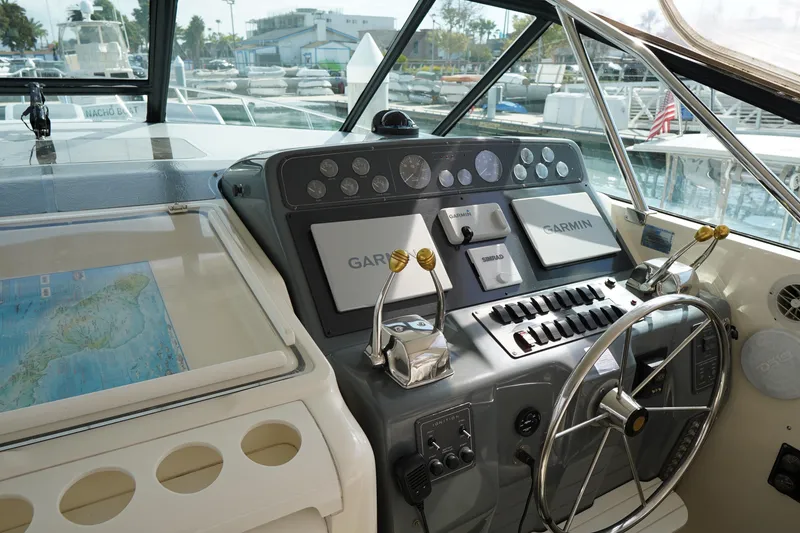 Slide: The Image of Cockpit of 1994 Tiara Yachts 4000 Express with Garmin navigation system and steering wheel. - 16