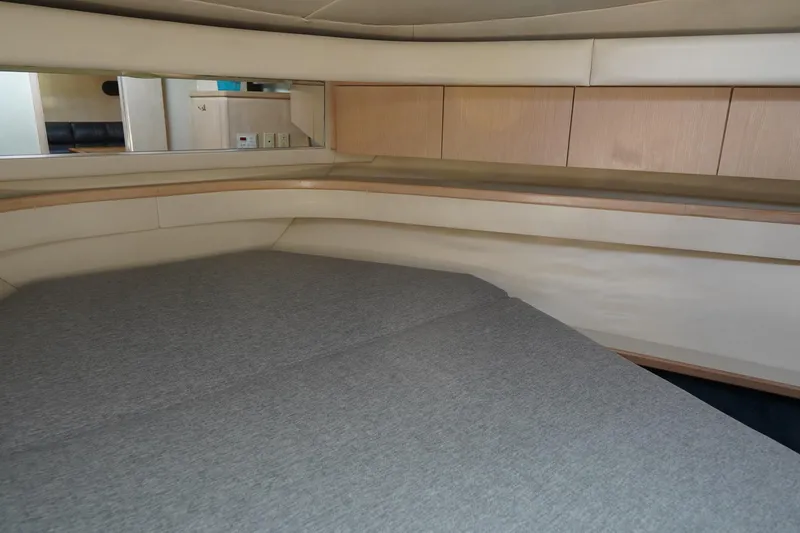 Slide: The Image of 1994 Tiara Yachts 4000 Express cabin interior with bed and wooden cabinetry. - 25