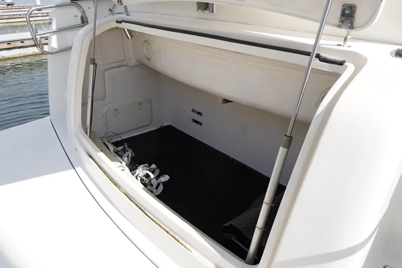 Slide: The Image of Open storage compartment on a 1994 Tiara Yachts 4000 Express boat. - 31