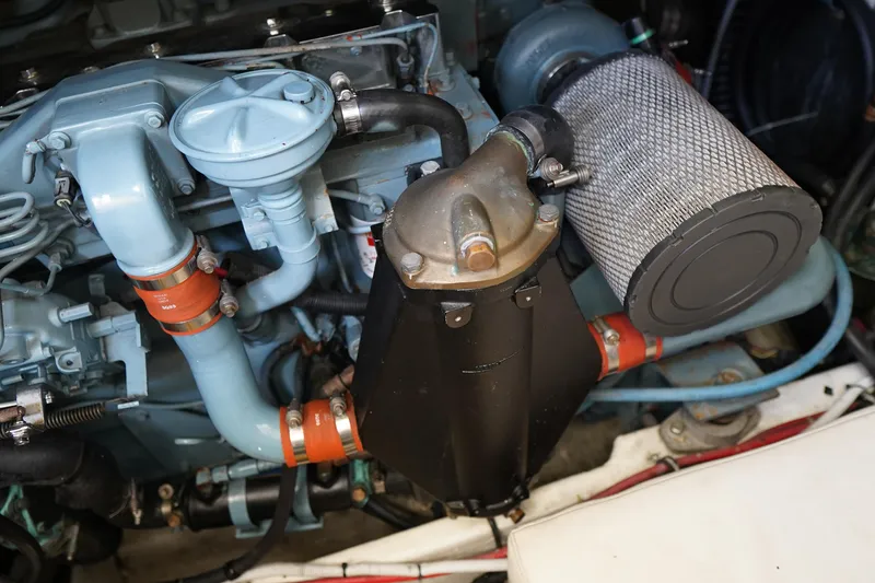 Slide: The Image of Engine compartment of a 1994 Tiara Yachts 4000 Express, showcasing detailed components. - 33