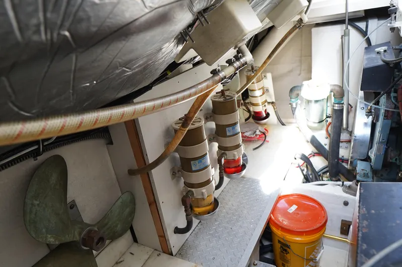 Slide: The Image of Engine room of a 1994 Tiara Yachts 4000 Express, showcasing mechanical components and equipment. - 34