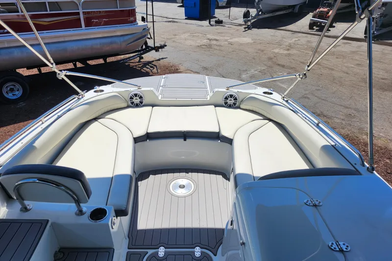 Slide: The Image of 2024 Stingray 212 SC boat interior with spacious seating and modern design. - 24