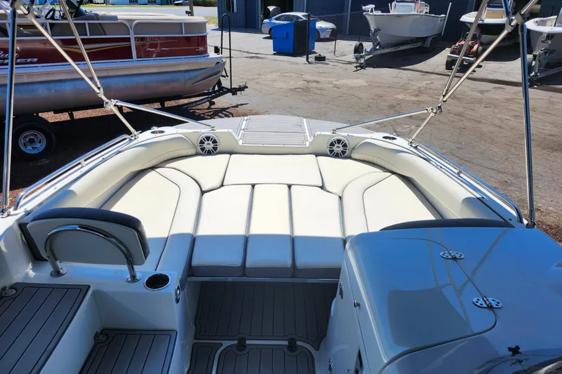 Slide: The Image of 2024 Stingray 212 SC boat interior with spacious seating and modern design. - 28