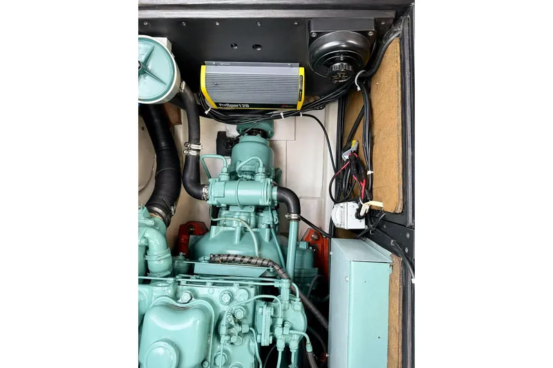 Slide: The Image of Cozy cabin interior of 1975 Apollo 32 Deluxe TT with bed and wooden accents. - 11