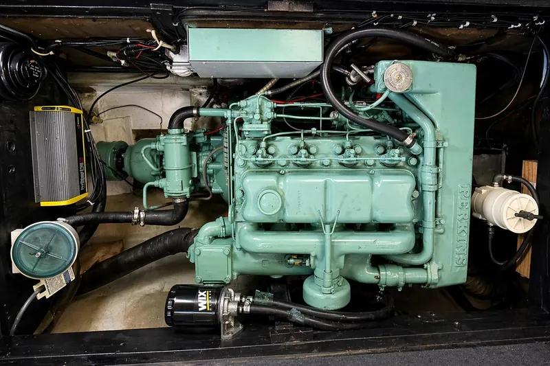 Slide: The Image of Cozy cabin interior of 1975 Apollo 32 Deluxe TT boat with beige cushions. - 12