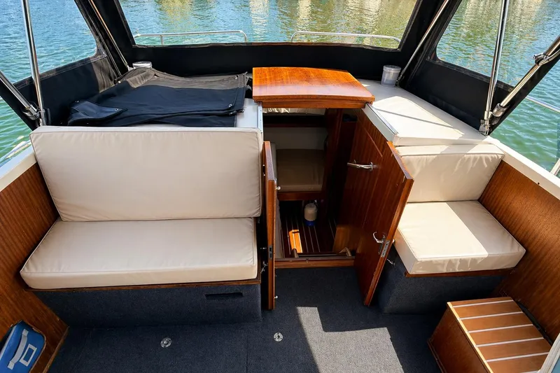 Slide: The Image of Compact bathroom in a 1975 Apollo 32 TT boat with sink, toilet, and mirror. - 13