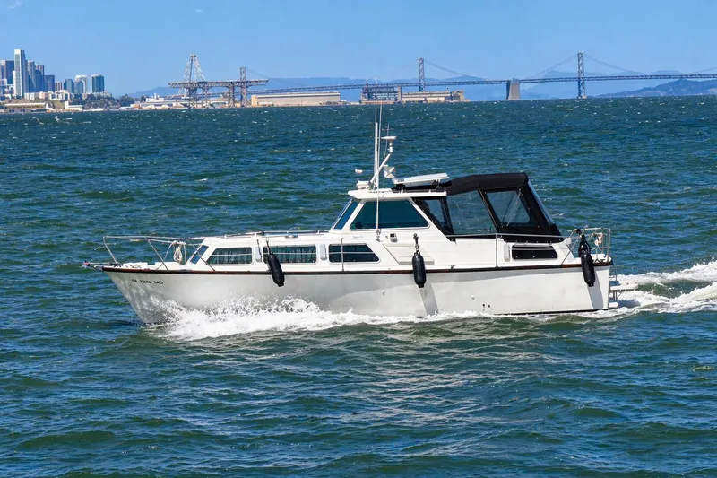 Slide: The Image of 1975 Apollo 32 Deluxe TT boat cruising on open water. - 3