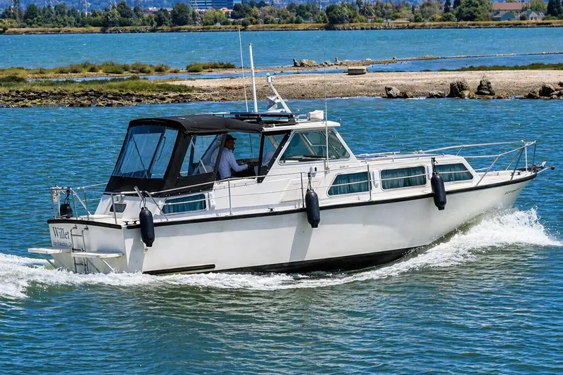 Slide: The Image of 1975 Apollo 32 Deluxe TT boat cockpit with vintage steering wheel and control panel. - 4