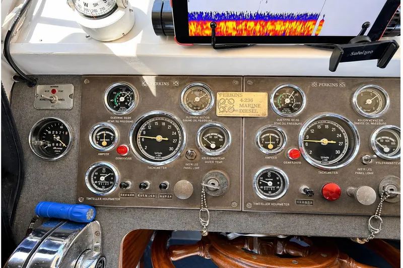 Slide: The Image of 1975 Apollo 32 Deluxe TT kitchen with oven, microwave, sink, and fridge in wood finish. - 8