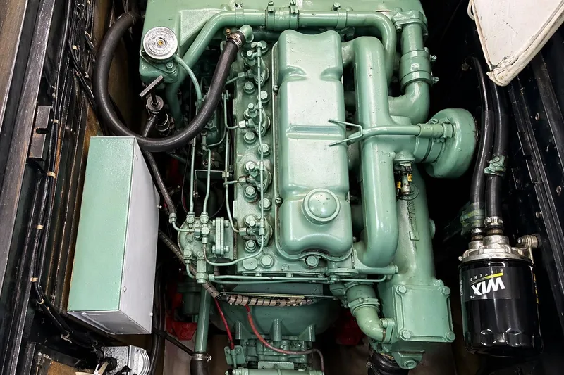 Slide: The Image of Luxurious 1975 Apollo 32 Deluxe TT yacht interior with wood finish and cozy seating area. - 9