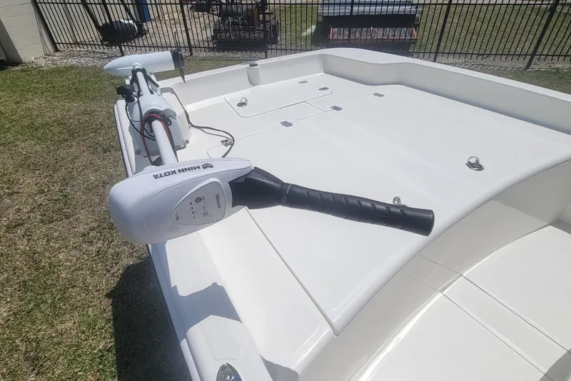 Slide: The Image of 2024 Mako Pro Skiff 17 CC boat with Minn Kota trolling motor on deck. - 9