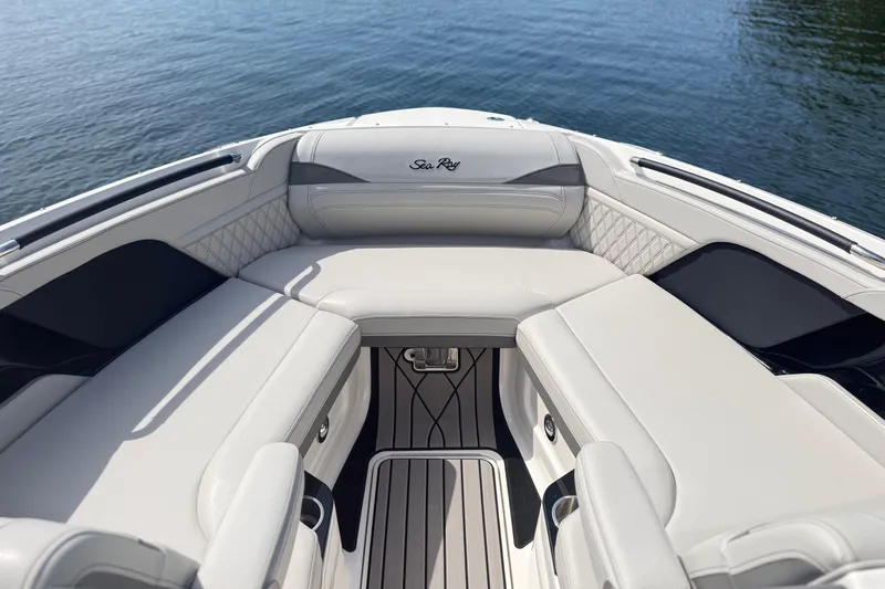 Slide: The Image of Luxurious seating on 2023 Sea Ray SLX 260 boat, overlooking calm water. - 17
