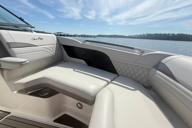 Slide: The Image of Luxurious seating on 2023 Sea Ray SLX 260 boat with scenic water view. - 19