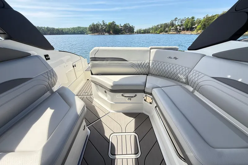 Slide: The Image of Luxurious interior of 2023 Sea Ray SLX 260 boat with elegant seating and scenic lake view. - 22