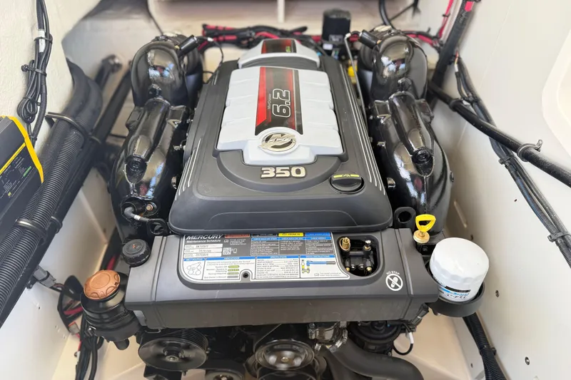 Slide: The Image of 2023 Sea Ray SLX 260 engine compartment featuring a powerful 6.2L Mercury 350 engine. - 26