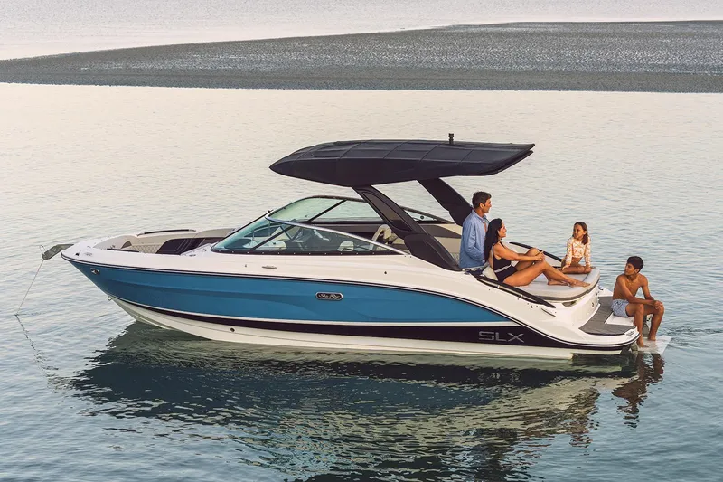 Slide: The Image of Manufacturer Provided Image: 2023 Sea Ray SLX 260 boat with people relaxing on calm water. - 28