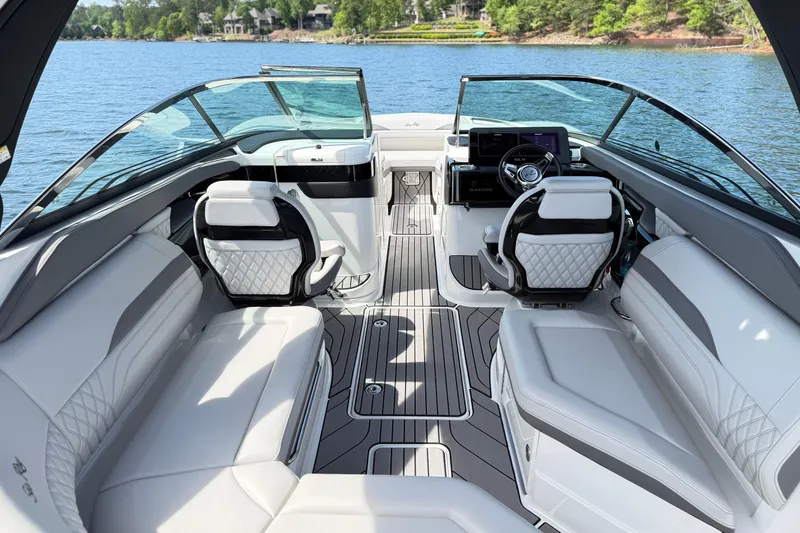 Slide: The Image of Luxurious interior of 2023 Sea Ray SLX 260 boat with elegant seating and modern dashboard. - 6