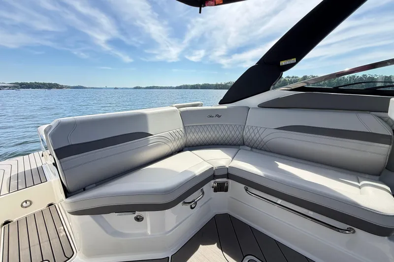 Slide: The Image of 2023 Sea Ray SLX 260 boat interior with luxurious seating and scenic water view. - 8