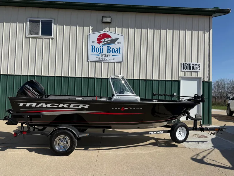 The Image of 2017 Tracker Pro Guide V-16 WT boat in front of Boji Boat building. - 0