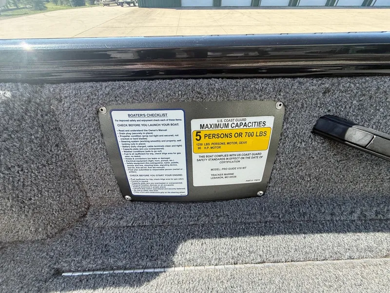 Slide: The Image of Safety and capacity labels on Tracker Pro Guide V-16 WT boat. - 12