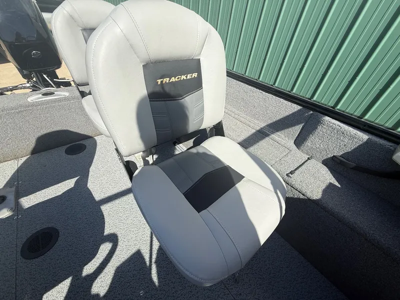 Slide: The Image of 2017 Tracker Pro Guide V-16 WT boat seat in gray interior. - 15