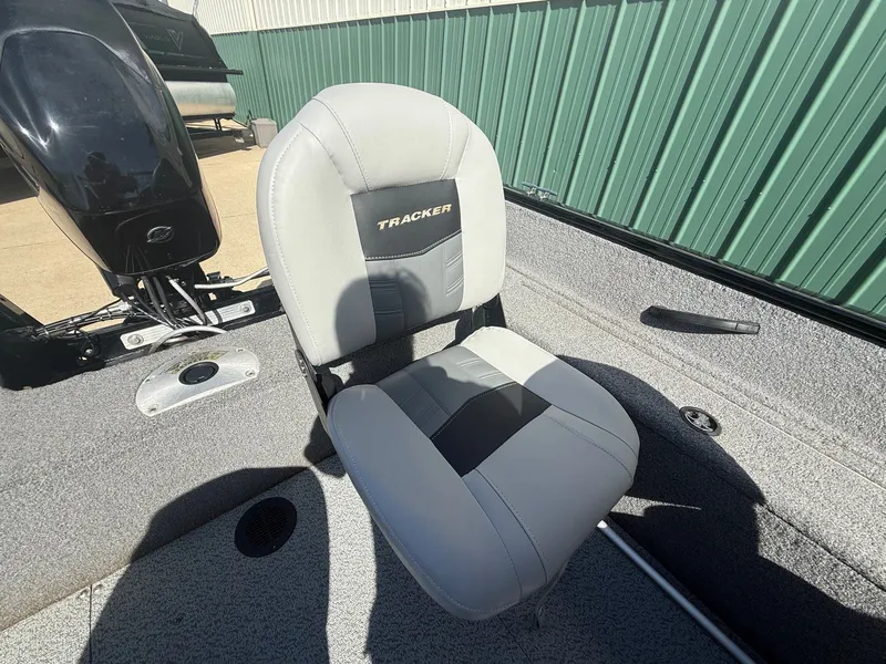 Slide: The Image of 2017 Tracker Pro Guide V-16 WT boat seat in gray design. - 16