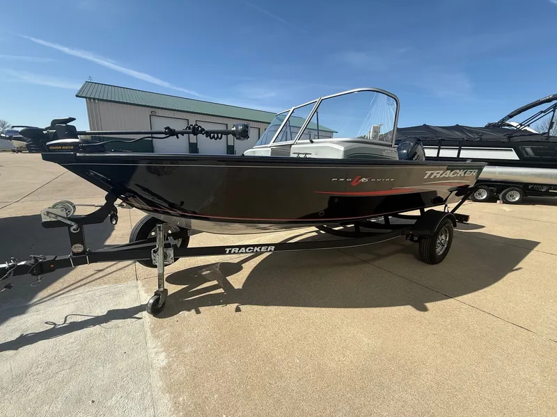 Slide: The Image of 2017 Tracker Pro Guide V-16 WT boat on trailer. - 2