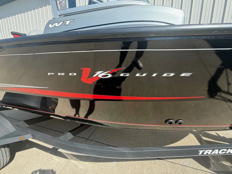 Slide: The Image of 2017 Tracker Pro Guide V-16 WT boat side view. - 27