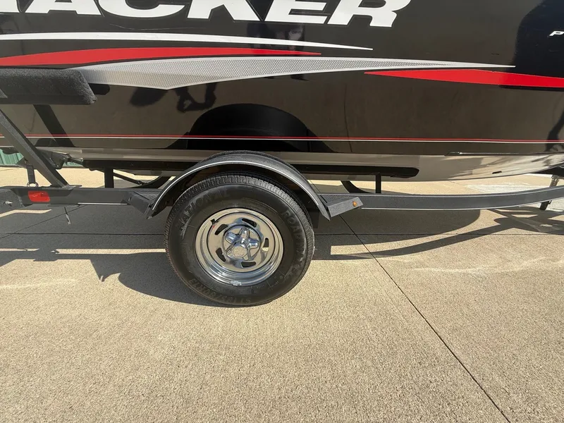 Slide: The Image of 2017 Tracker Pro Guide V-16 WT boat trailer on concrete surface. - 28