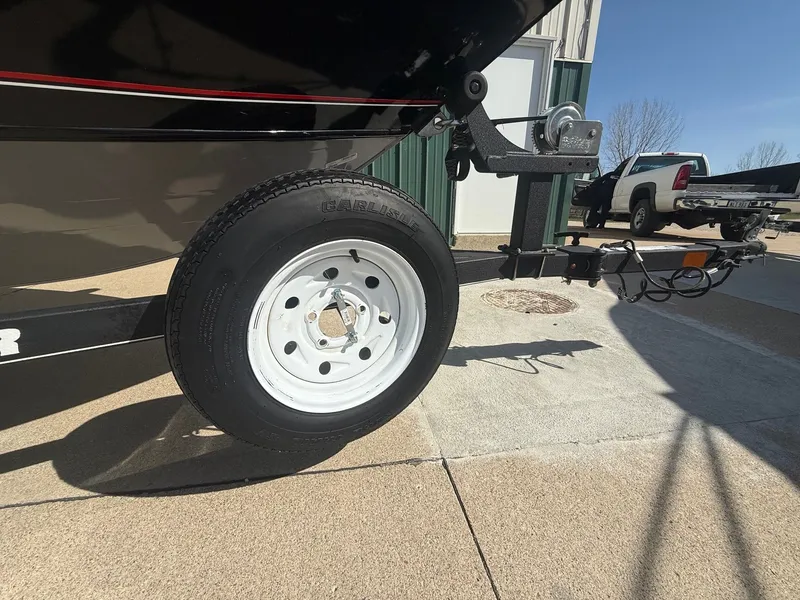 Slide: The Image of 2017 Tracker Pro Guide V-16 WT boat trailer on parking lot. - 29