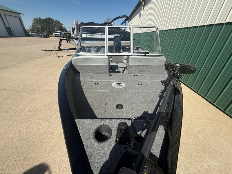 Slide: The Image of 2017 Tracker Pro Guide V-16 WT boat on parking lot. - 3