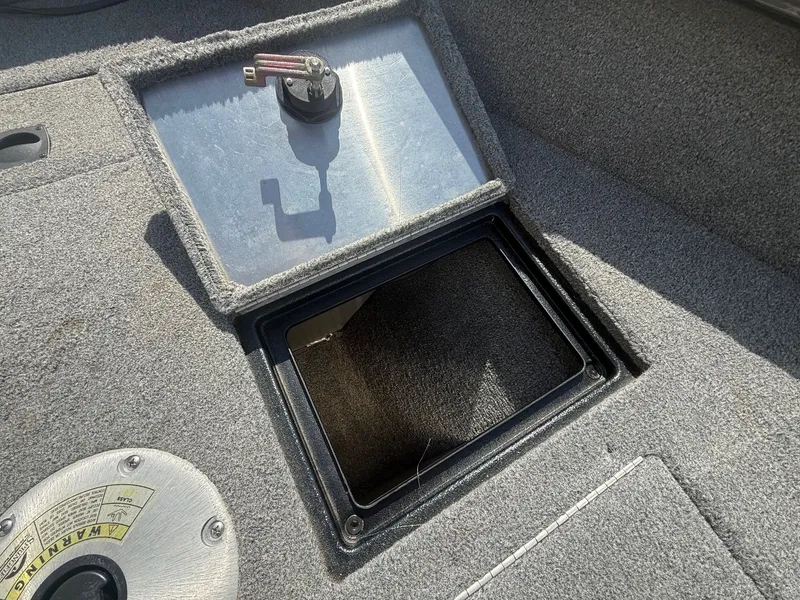 Slide: The Image of 2017 Tracker Pro Guide V-16 WT boat deck with storage compartment. - 8