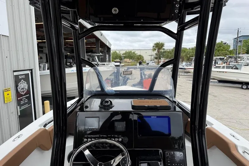 Slide: The Image of Interior view of 2026 Sea Pro 225FLX Sandbar boat dashboard and controls. - 10