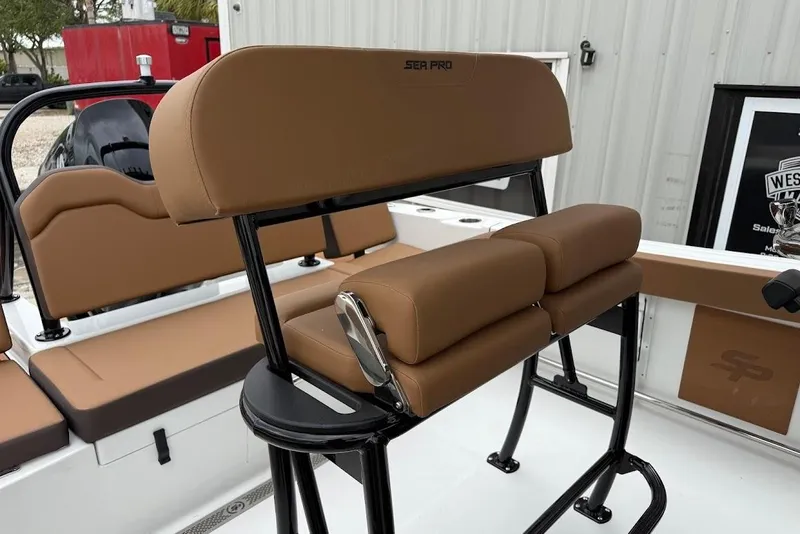 Slide: The Image of 2026 Sea Pro 225FLX Sandbar boat interior with tan seating and sleek design. - 11