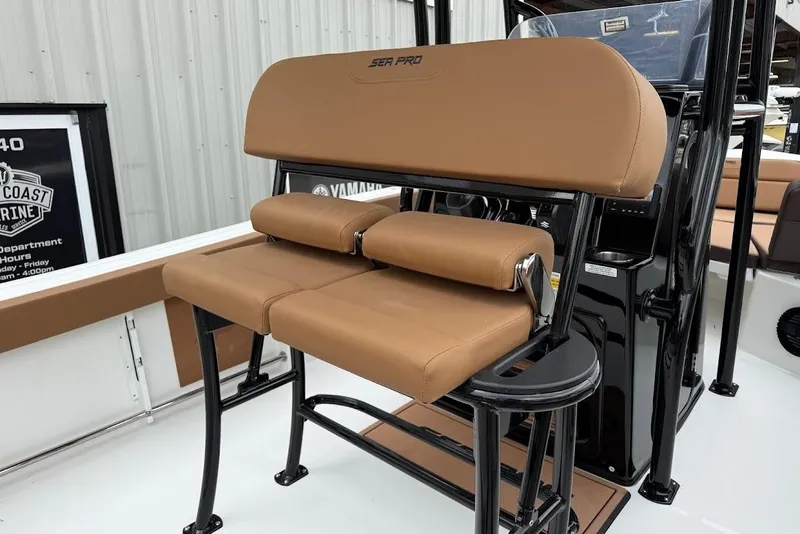 Slide: The Image of 2026 Sea Pro 225FLX Sandbar boat with tan seating and black frame. - 13