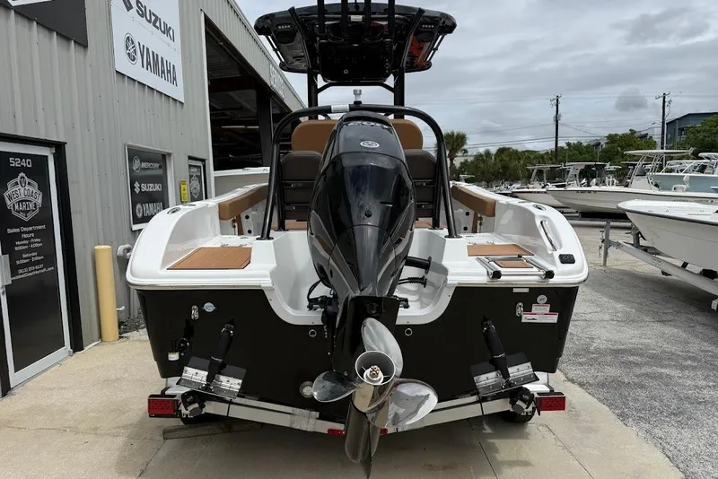 Slide: The Image of 2026 Sea Pro 225FLX Sandbar boat at dealership, rear view with outboard motor. - 4