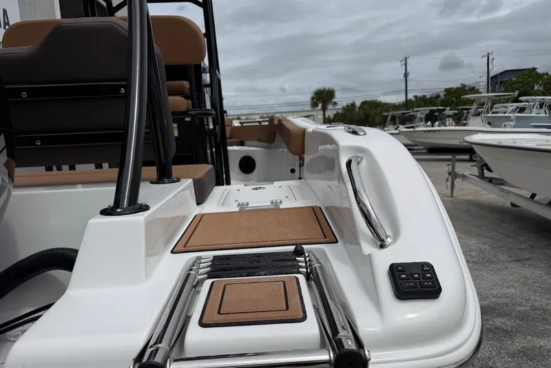 Slide: The Image of 2026 Sea Pro 225FLX Sandbar boat deck with seating and control panel. - 8
